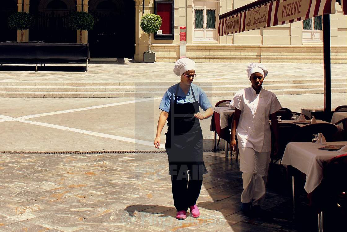 "Three trees, two cooks, pink shoes." stock image