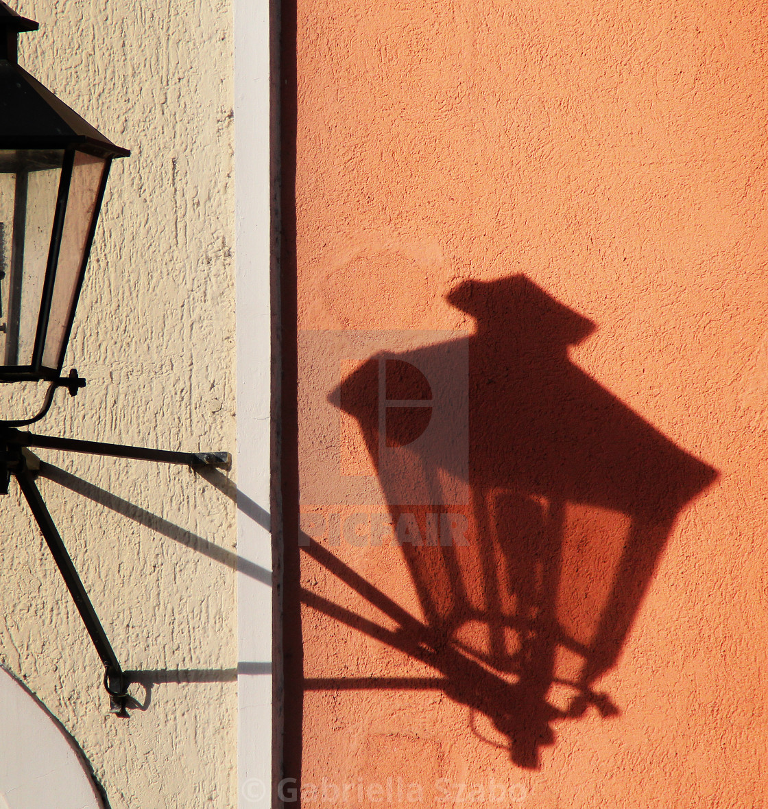 "shadow on the wall" stock image