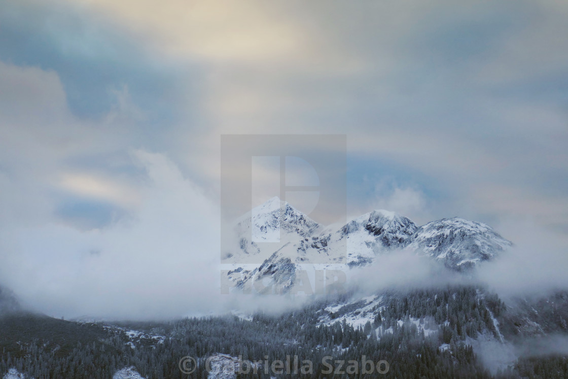 "clouds in the mountains" stock image