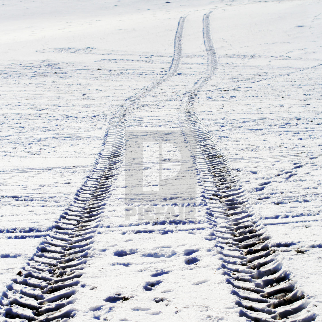 "wheel track in the snow" stock image