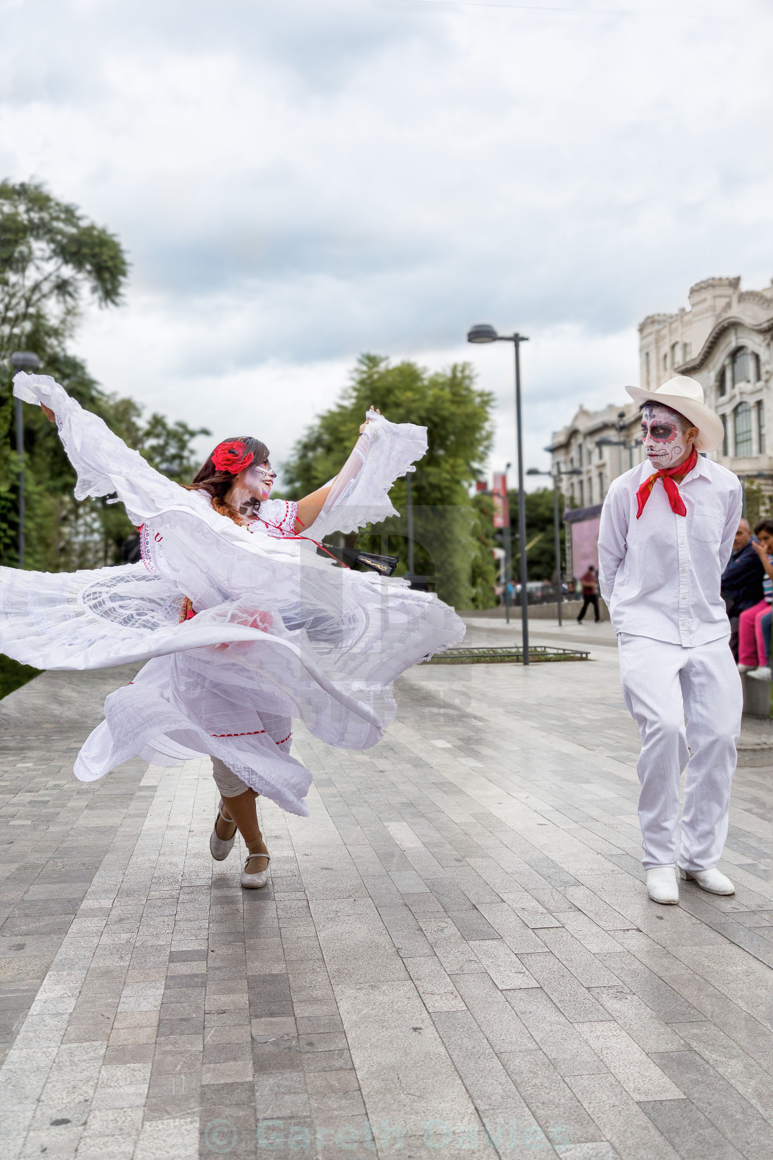 A Couple In Traditional Clothing Dance Outside Bellas Artes For