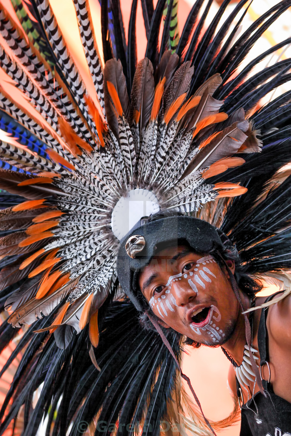 A young boy wearing a colourful 