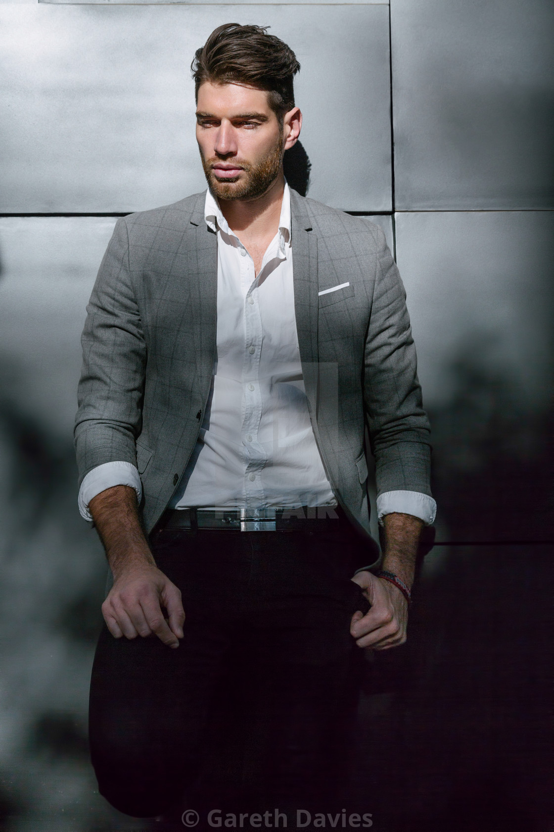 "A male fashion model standing up against a wall in jacket, shirt and trousers" by Gareth Davies - $77.88 "A male fashion model standing up against a wall in jacket, shirt and trousers" stock image