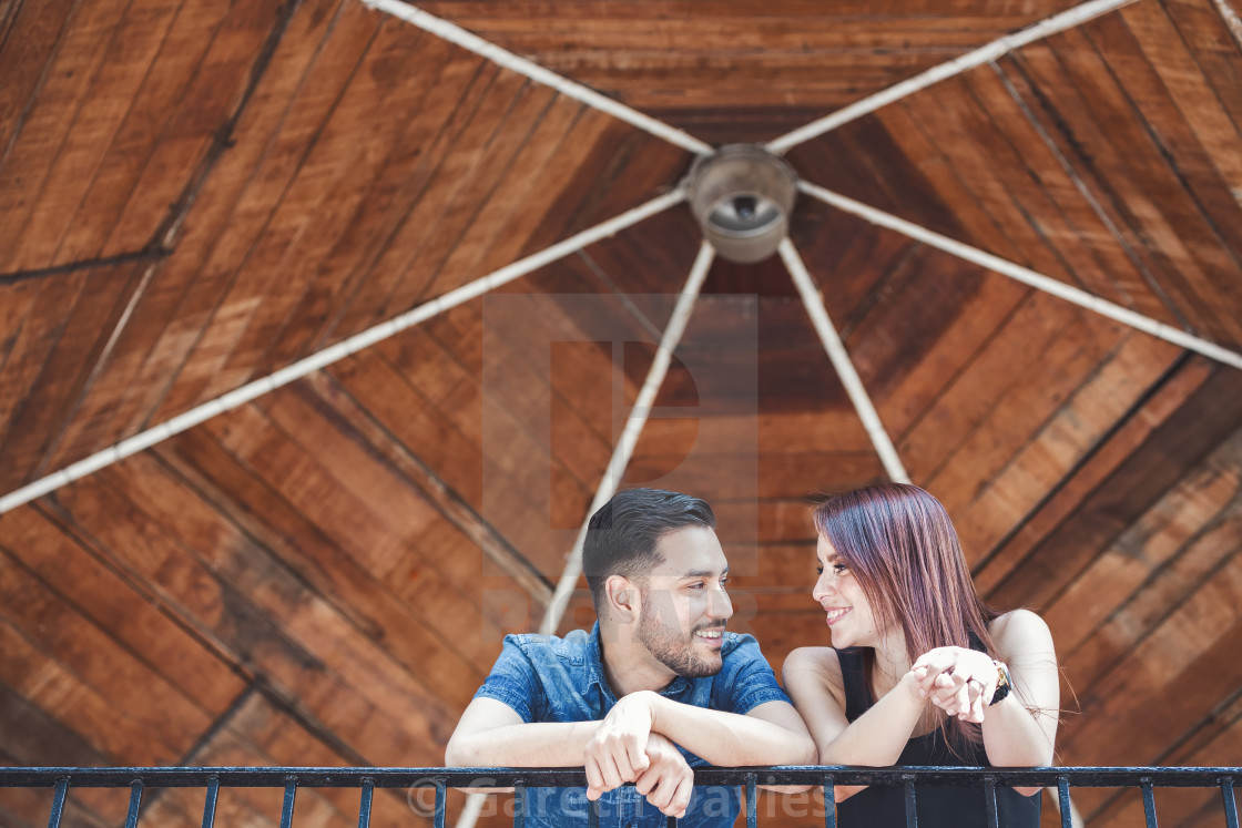 "A couple of latin lovers talking to one another leaning over a balcony" by Gareth Davies - $28.04 "A couple of latin lovers talking to one another leaning over a balcony" stock image