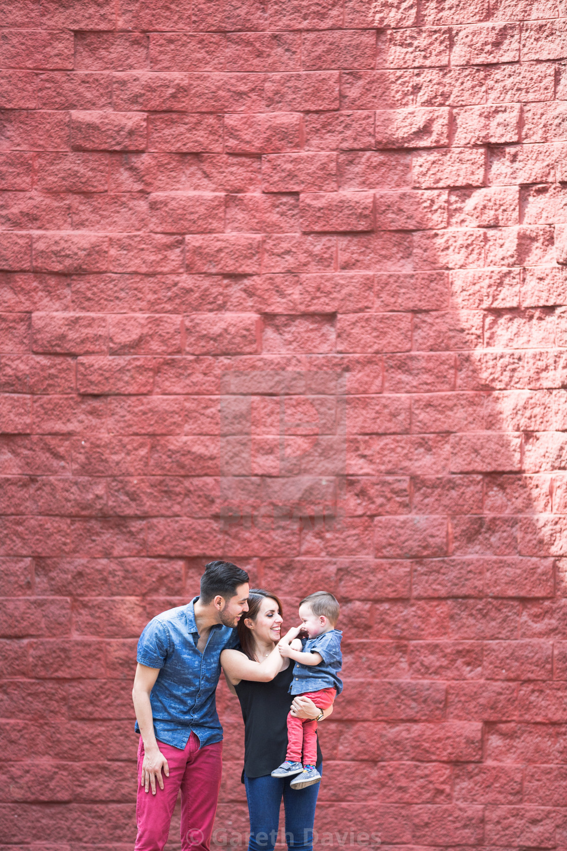 "A latin couple playing with their baby in the exterior" by Gareth Davies - $28.04 "A latin couple playing with their baby in the exterior" stock image