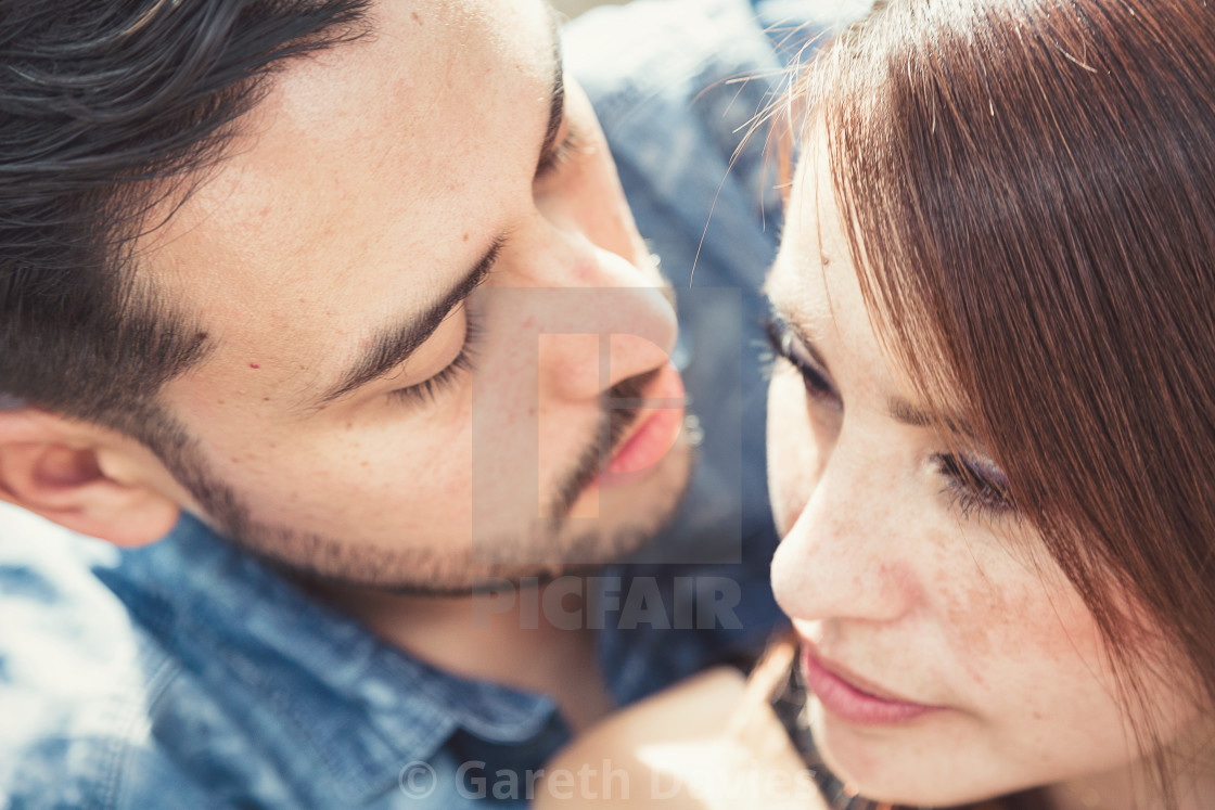 "Colour portrait of a couple looking at one another intimately and closely" by Gareth Davies - $31.15 "Colour portrait of a couple looking at one another intimately and closely" stock image