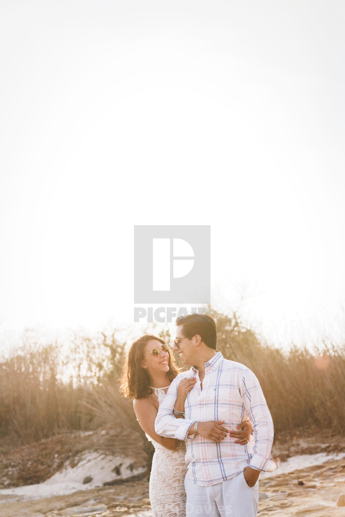 "Young Mexican couple on the beach at sunset" by Gareth Davies - $28.04 "Young Mexican couple on the beach at sunset" stock image