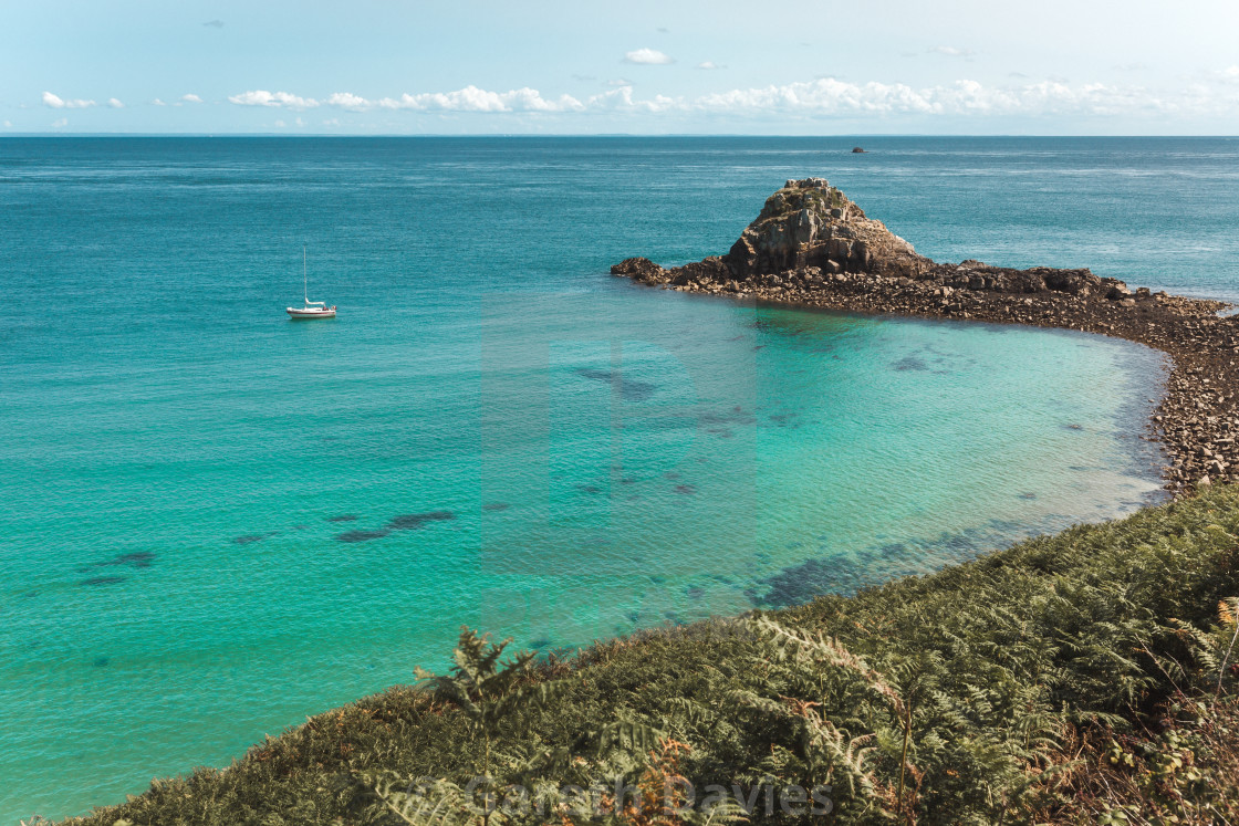 "A solo yacht moored in a beautiful beach in Herm, Channel islands" by Gareth Davies - $1.56 "A solo yacht moored in a beautiful beach in Herm, Channel islands" stock image