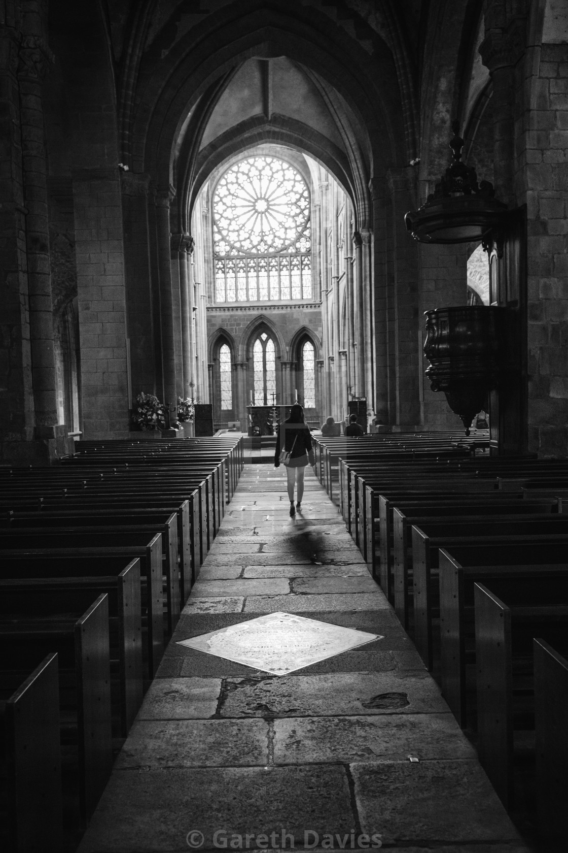 "A woman walking down the aisle of a dark cathedral approach the altar" by Gareth Davies - $1.56 "A woman walking down the aisle of a dark cathedral approach the altar" stock image