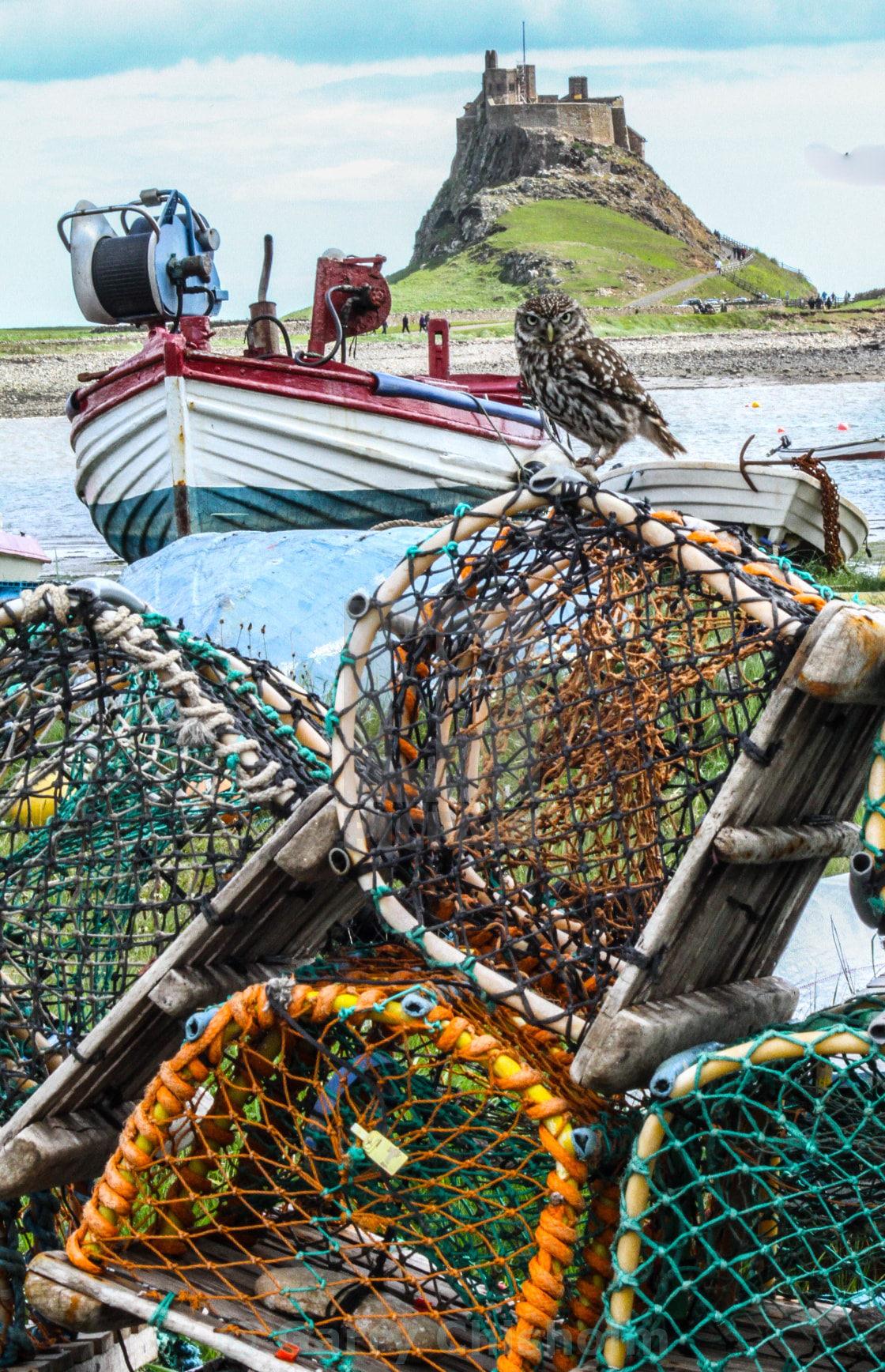 "Lobster pots, an owl, a boat and a castle" stock image