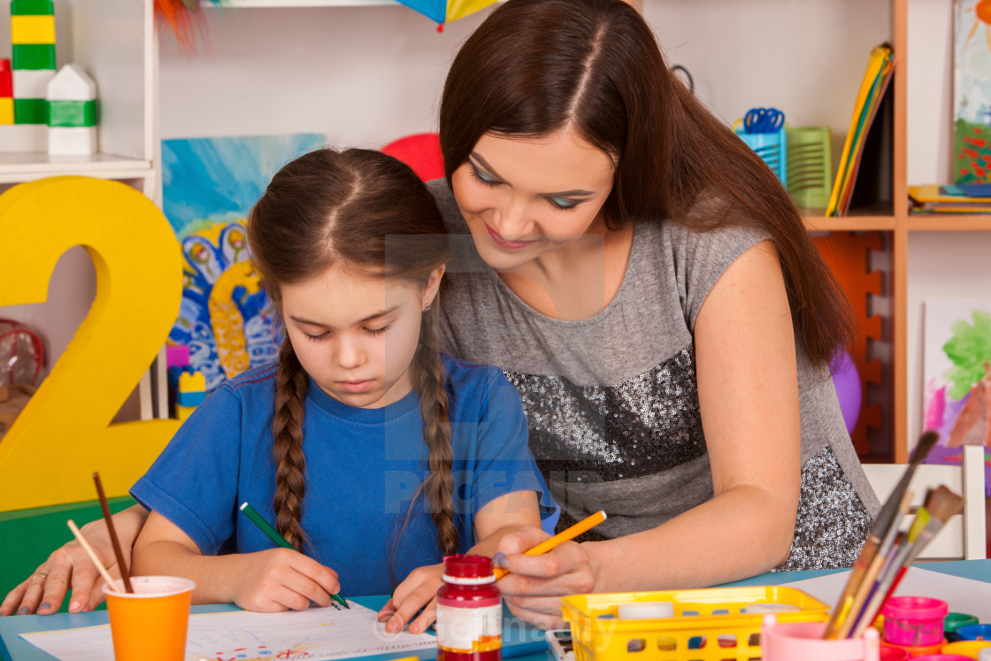Children Painting Finger On Easel Group Of Kids With Teacher