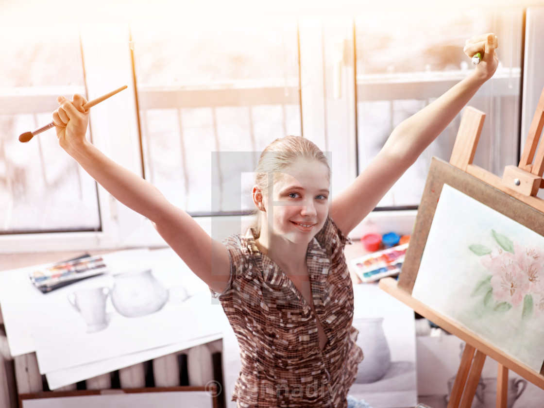 Artist Painting On Easel In Studio Girl Paints With Brush