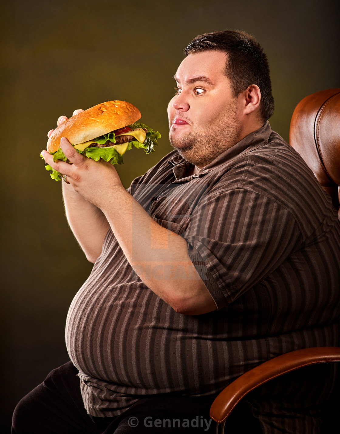 "Fat man eating fast food hamberger. 