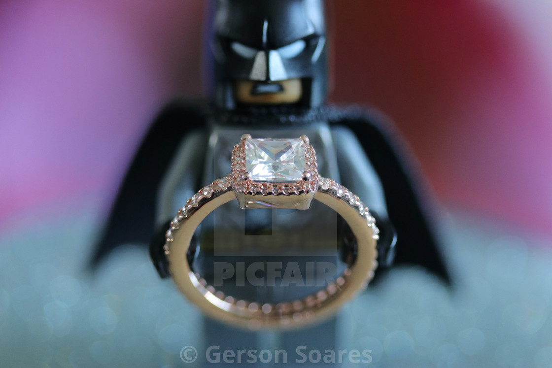Batman holding a rose gold Pandora ring - License, download or print for  £ | Photos | Picfair