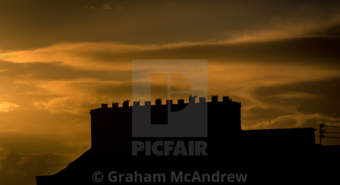 "Chimneys stacks and Roof-tops at sunset" stock image