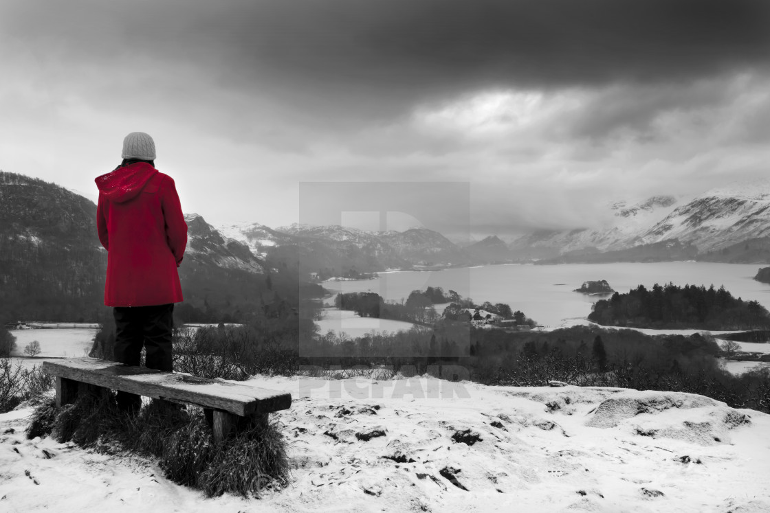 "Red coat over Derwent Water, looking at the view" stock image