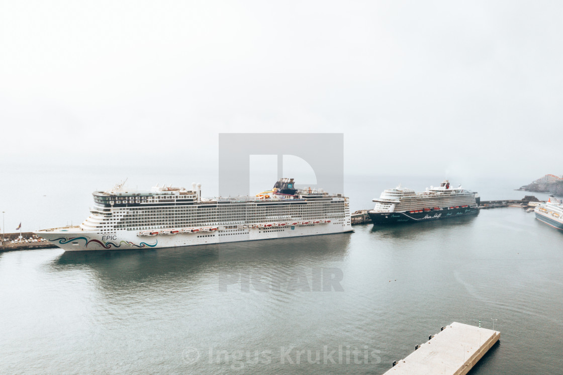 "huge cruise ship docked at the Madeira island" stock image