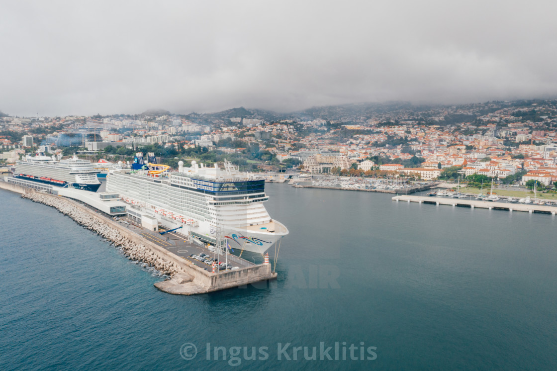 "huge cruise ship docked at the Madeira island" stock image