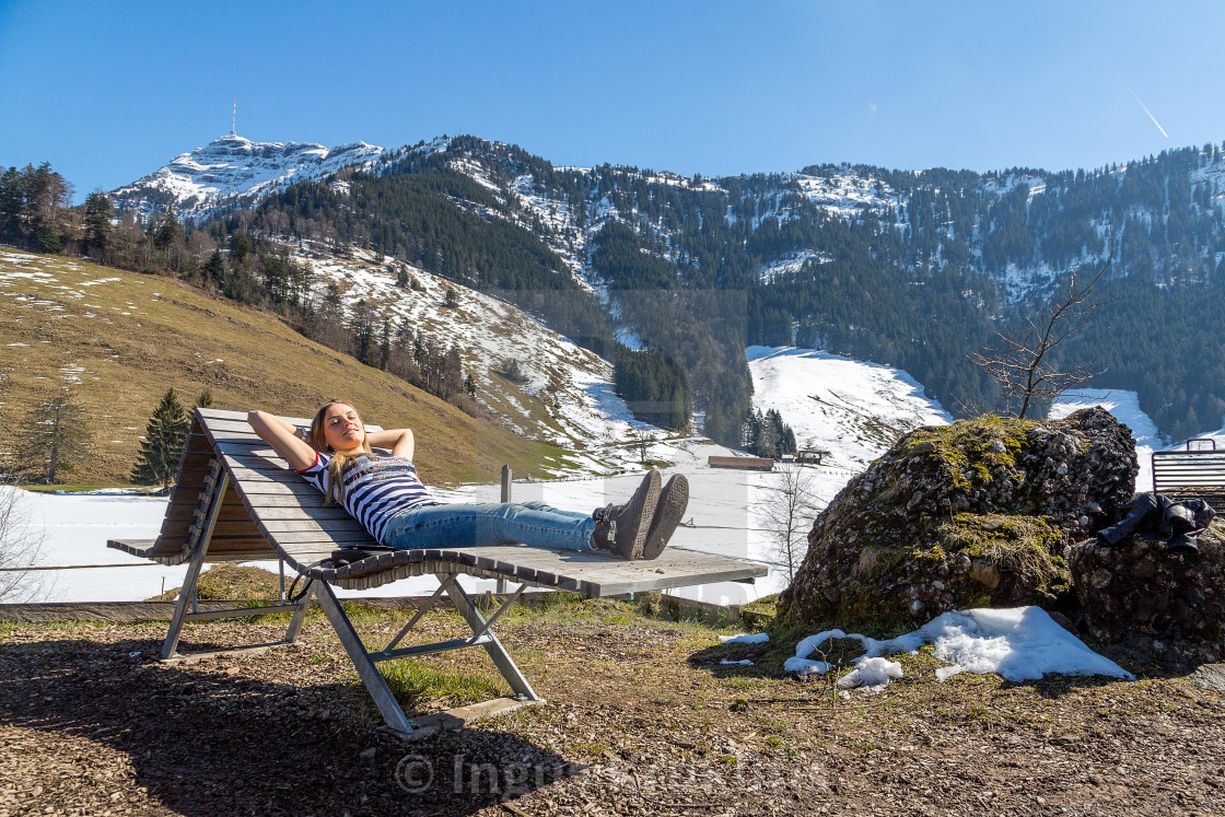 "Beautiful girl relaxing in the Swiss mountains with an astonishing view" stock image