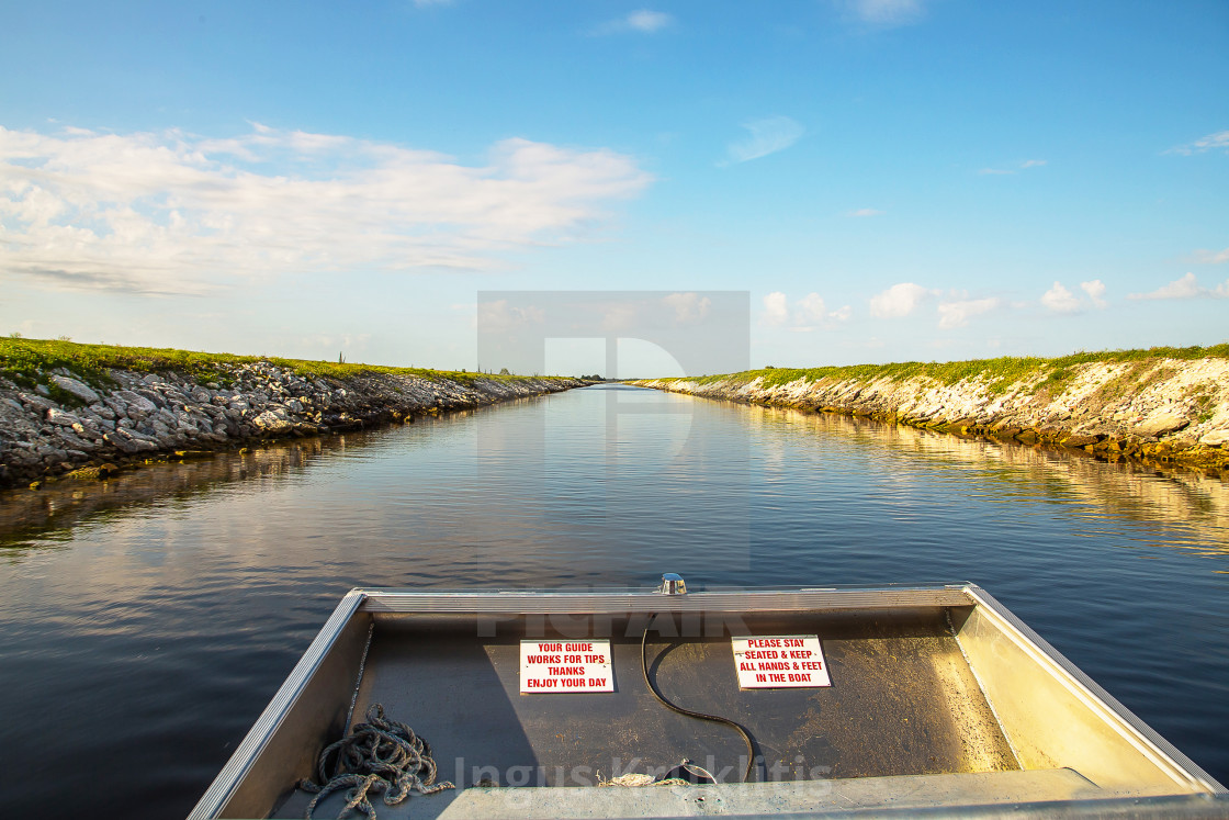 "Airboat driving through a narrow channel to the swamp searching for the..." stock image