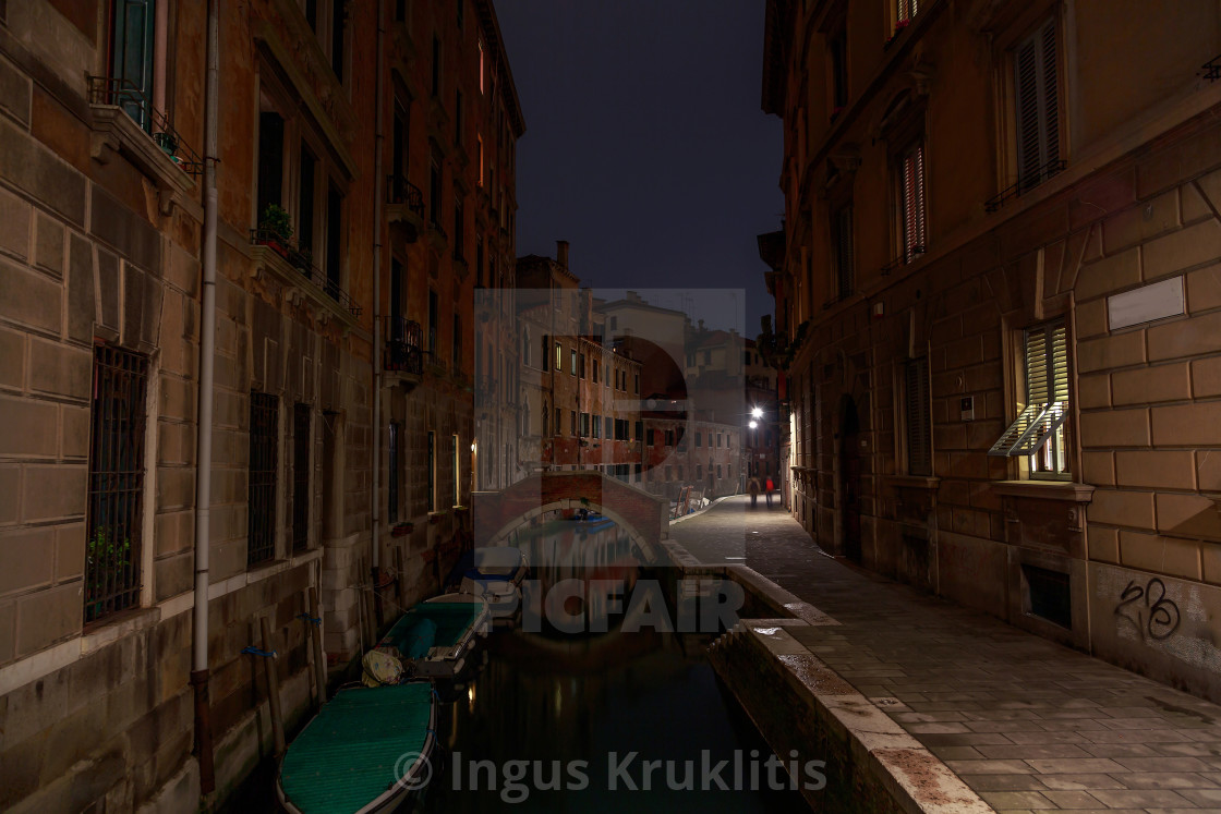 "Empty narrow cozy canals of Venice in the middle of the night. No people at..." stock image