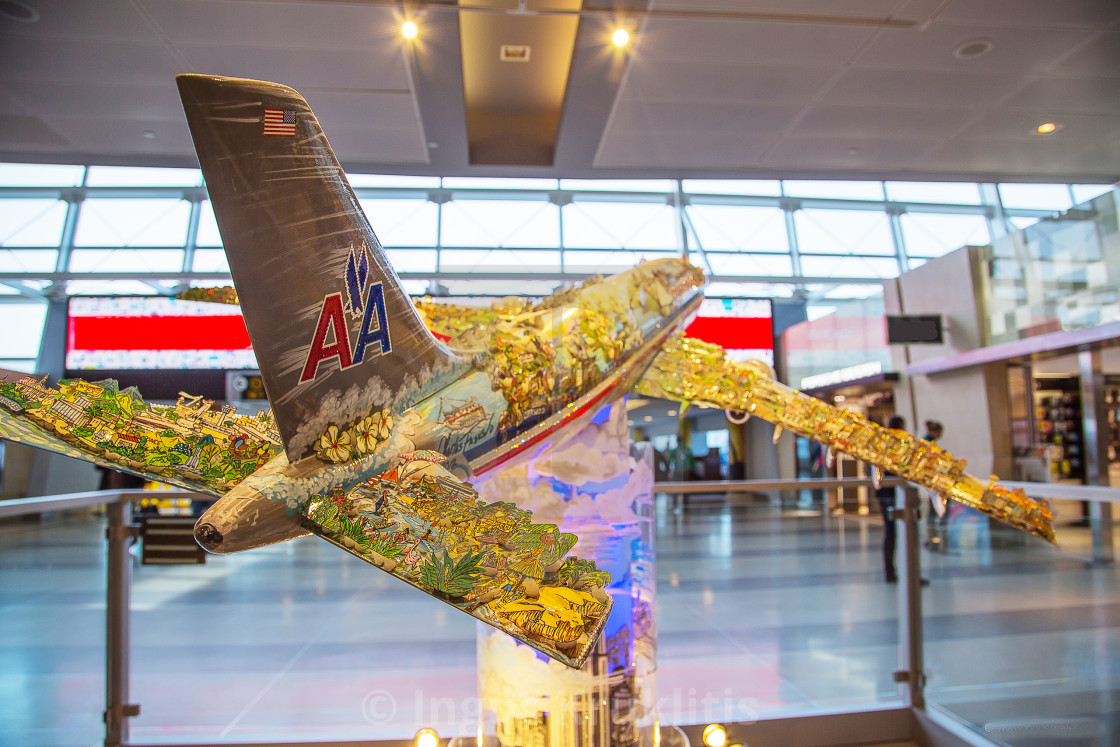 "Beautiful airplane model decorated with different city symbols located in the..." stock image