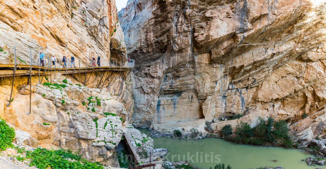 "Wooden path encrusted in yellow cliff going through river canyon in Spain" stock image