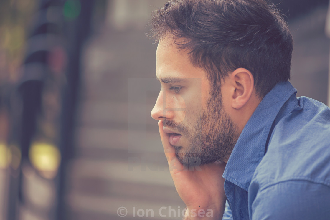 Side Profile Sad Depressed Stressed Young Businessman Sitting Outside Corporate Office License Download Or Print For 18 60 Photos Picfair Pictogram scene of looking down and bending forward. https www picfair com pics 05395644 side profile sad depressed stressed young businessman sitting outside corporate office