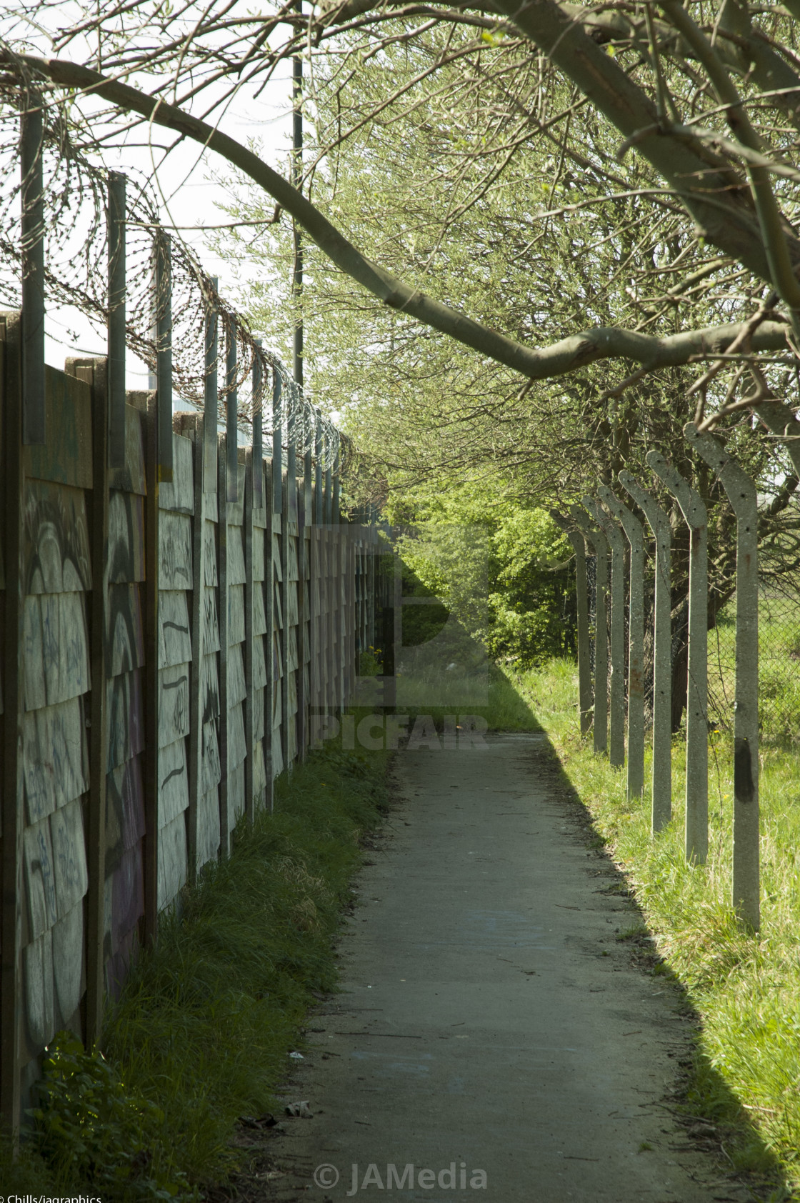 "spring sun softens the brutal baracaide" stock image