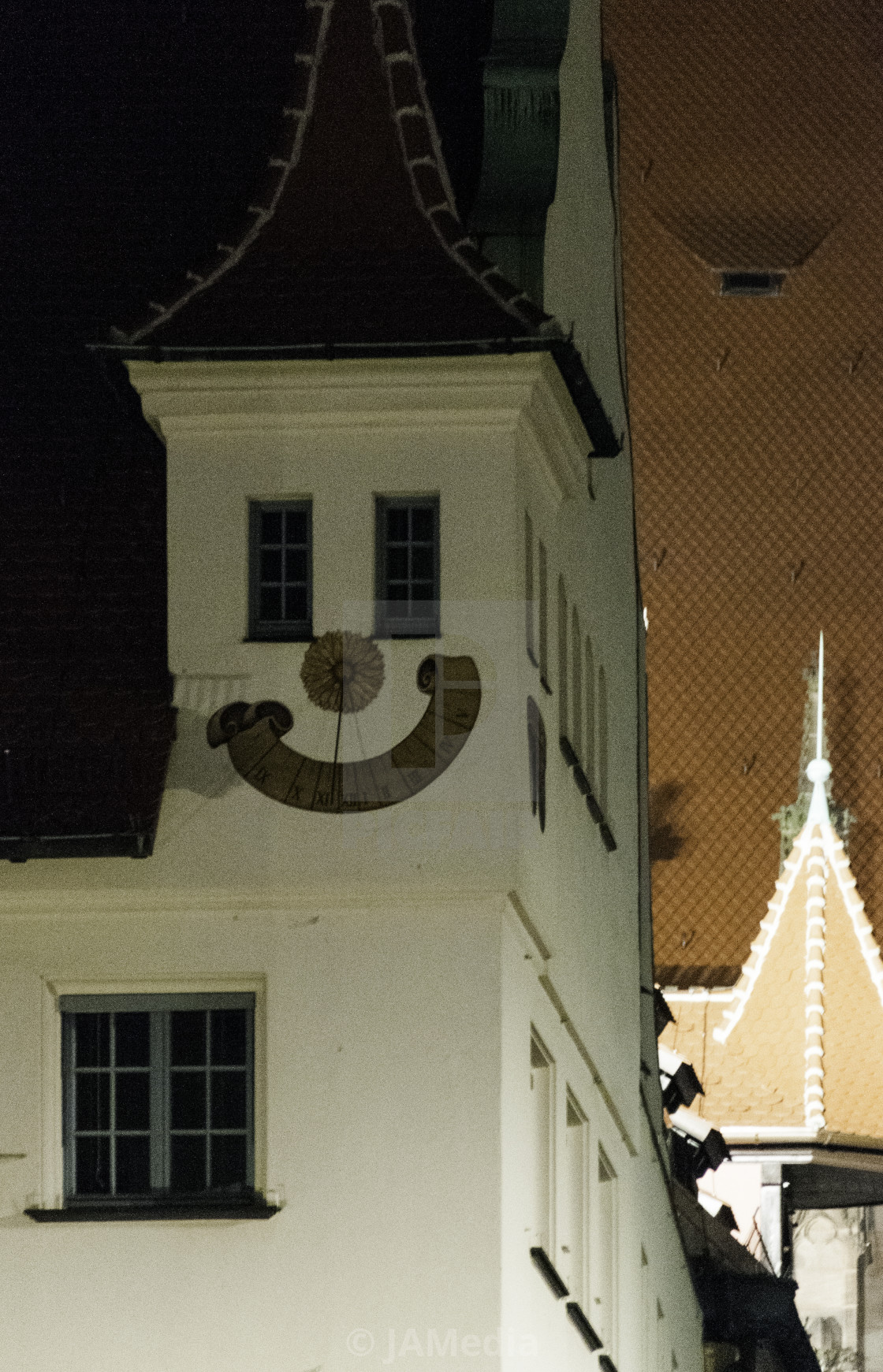 "Smily face sundial at night" stock image