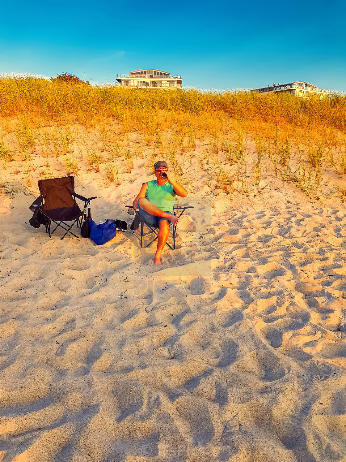 Man Is Sitting On A Beach Chair License Download Or Print For 8 68 Photos Picfair