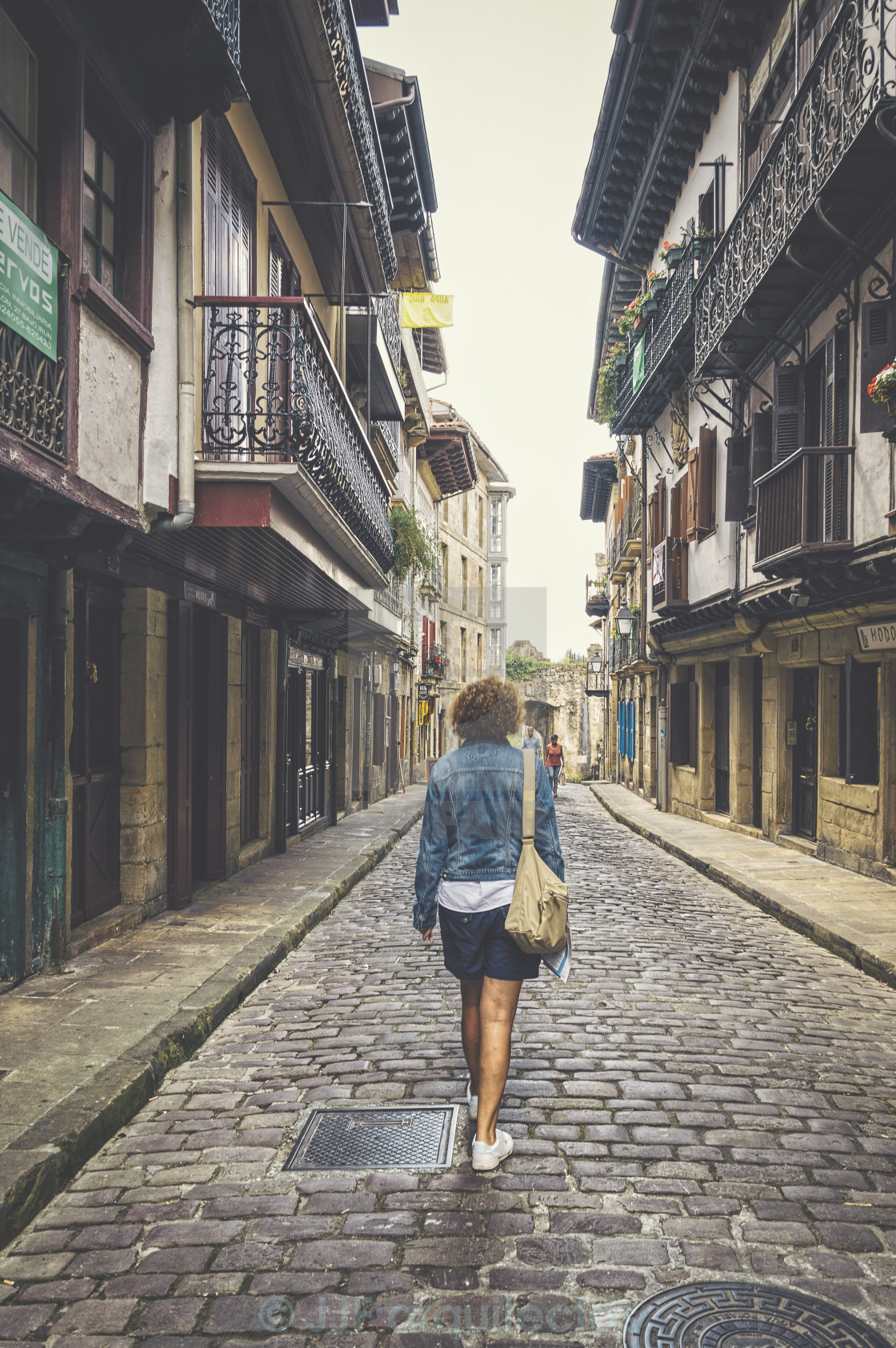 "Woman walking down" stock image