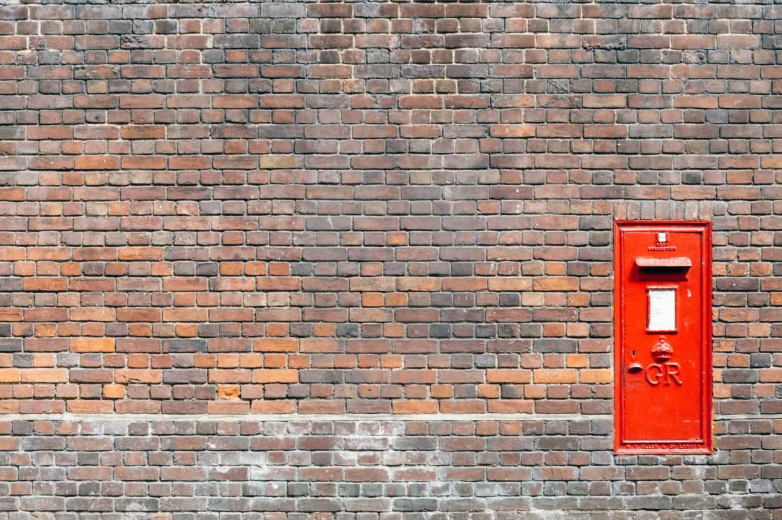 "Red mail box in a brick wall" stock image