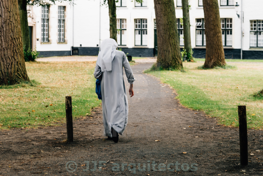 "Nun walking in the park" stock image