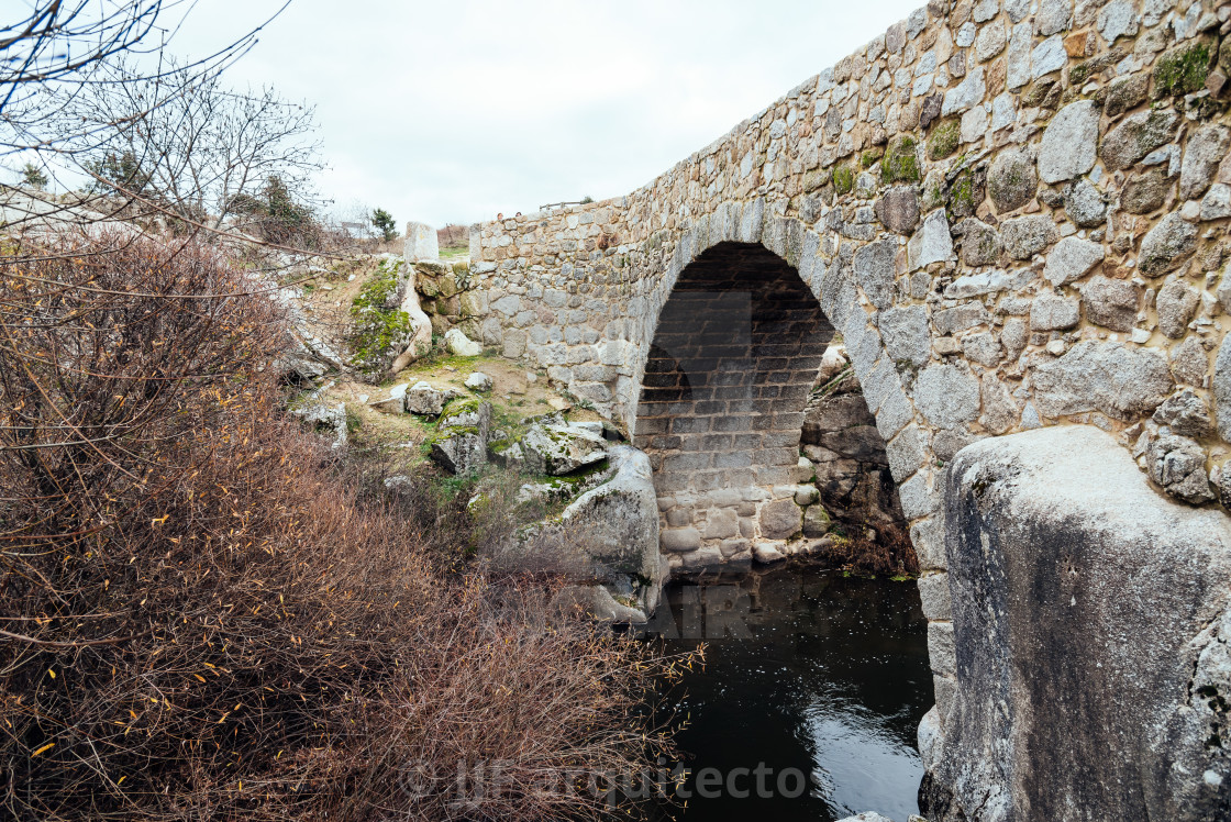 "Medieval bridge at Colmenar, Spain" stock image