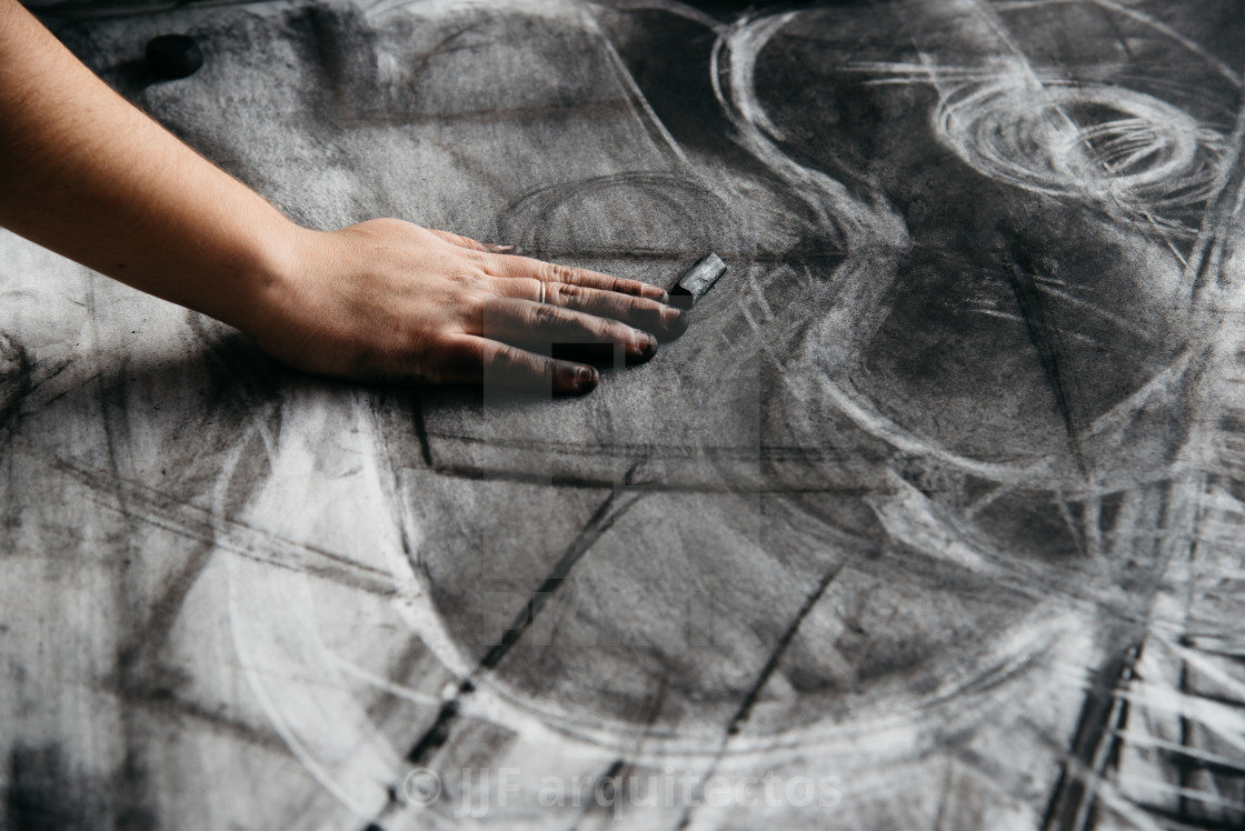 "Young artist painting with charcoal" stock image