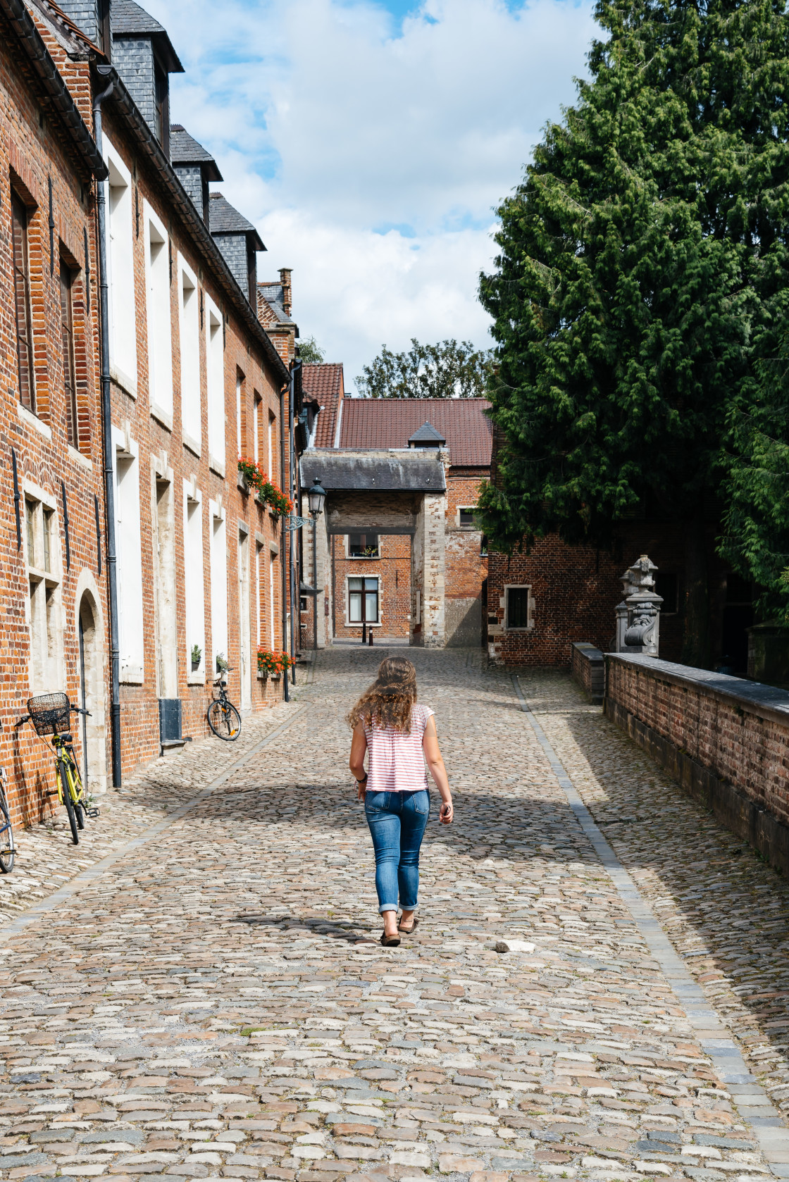 "Student walking on the street in Beguinage of Leuven" stock image