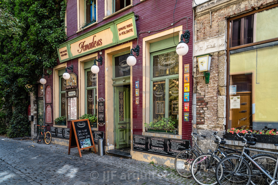 "Picturesque restaurant with bicycles parked and flowers" stock image