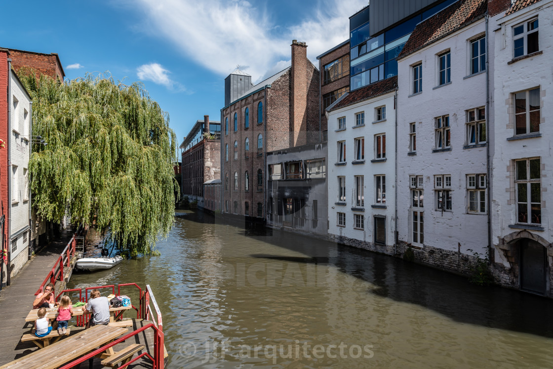 "Canal in the historic center of Ghent with picturesque old build" stock image