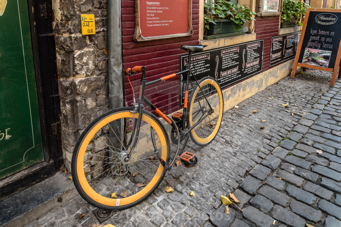 "Picturesque restaurant with bicycles parked and flowers" stock image