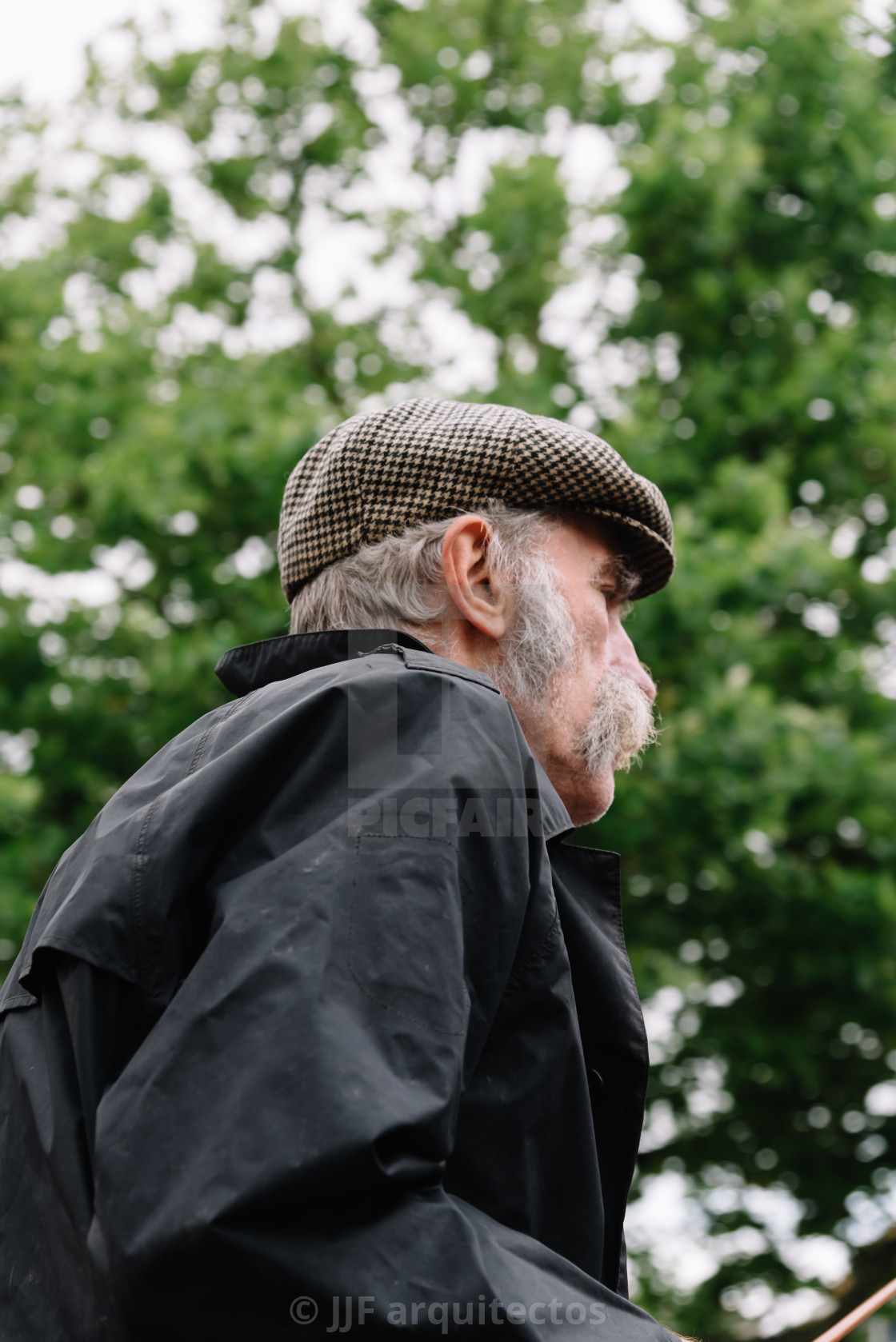 "Traditional producers in Gouda Cheese Market a rainy day" stock image