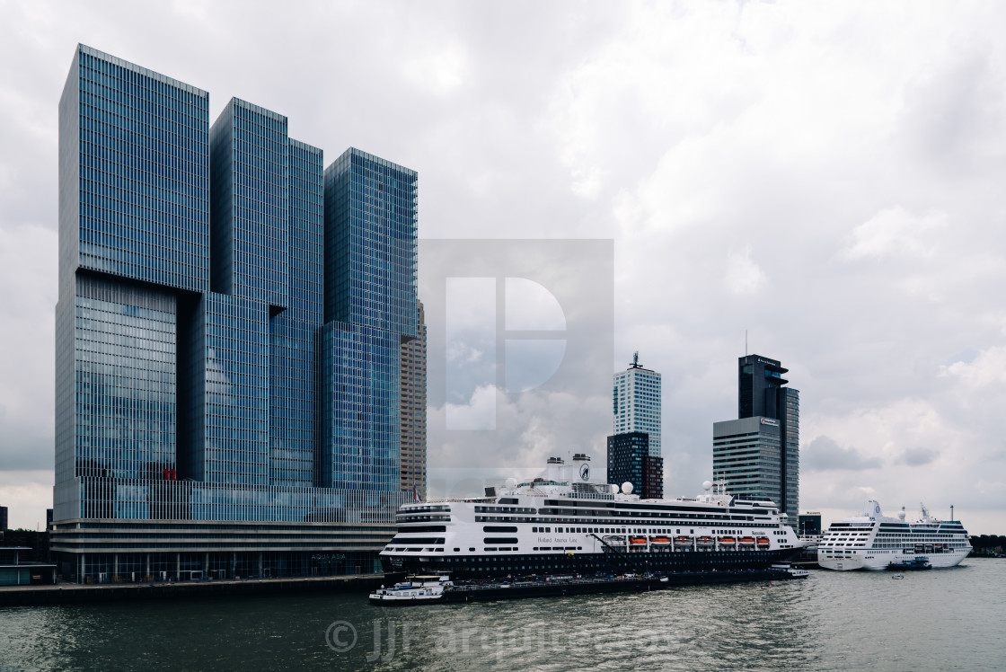 "Cruises with skyscrapers at background in the harbor of Rotterda" stock image