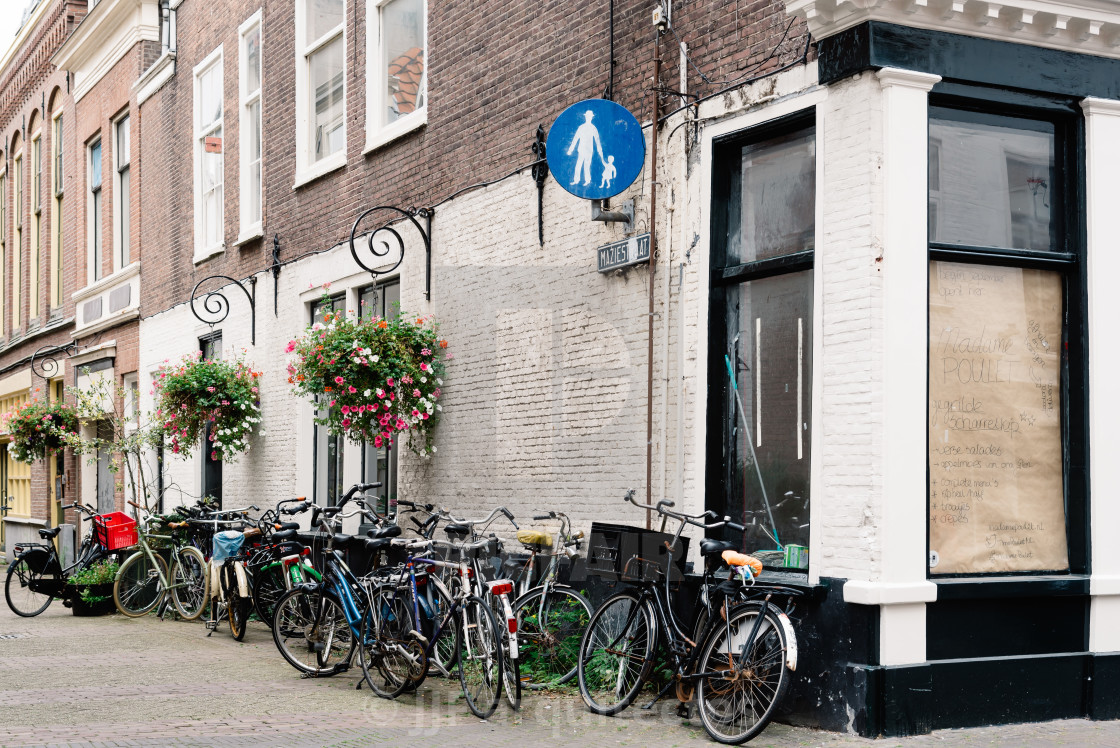 "View of typical street in the Hague with bicycles parked" stock image