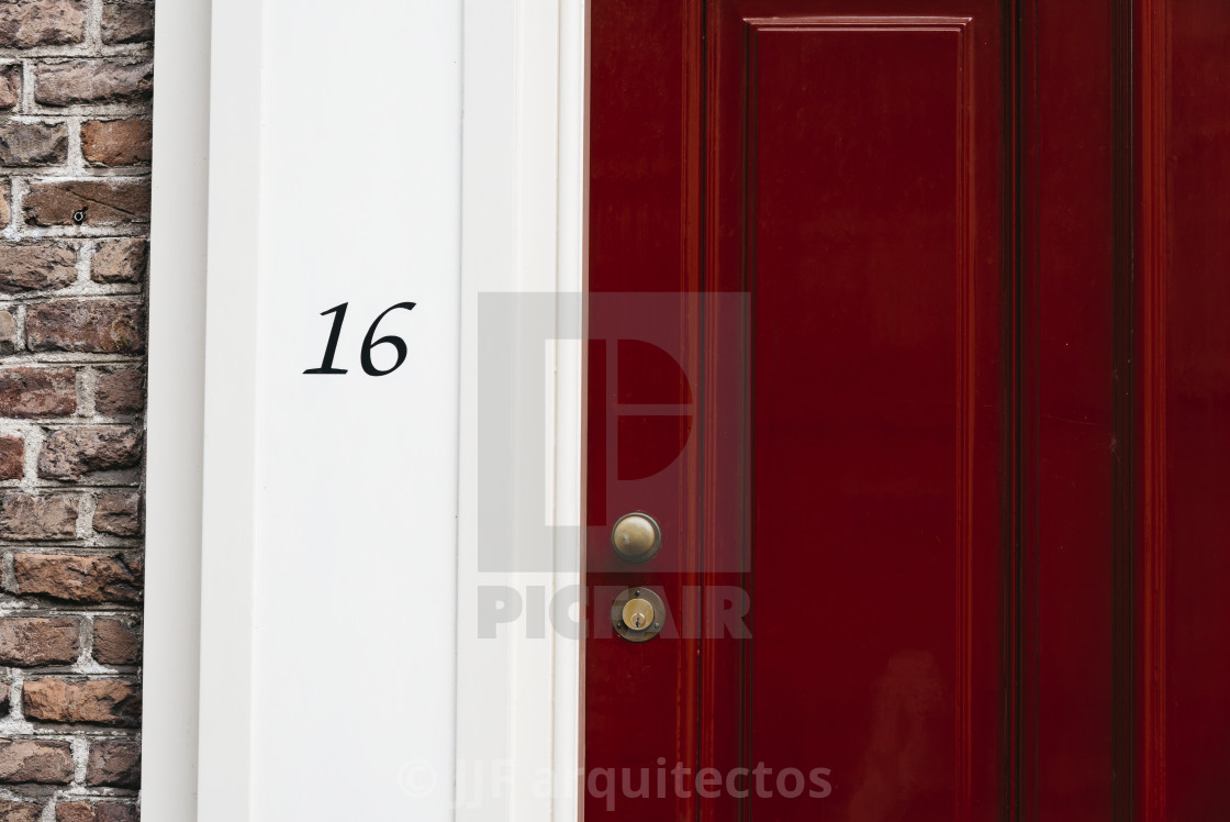 "Classic red door with number 16. Vintage style" stock image