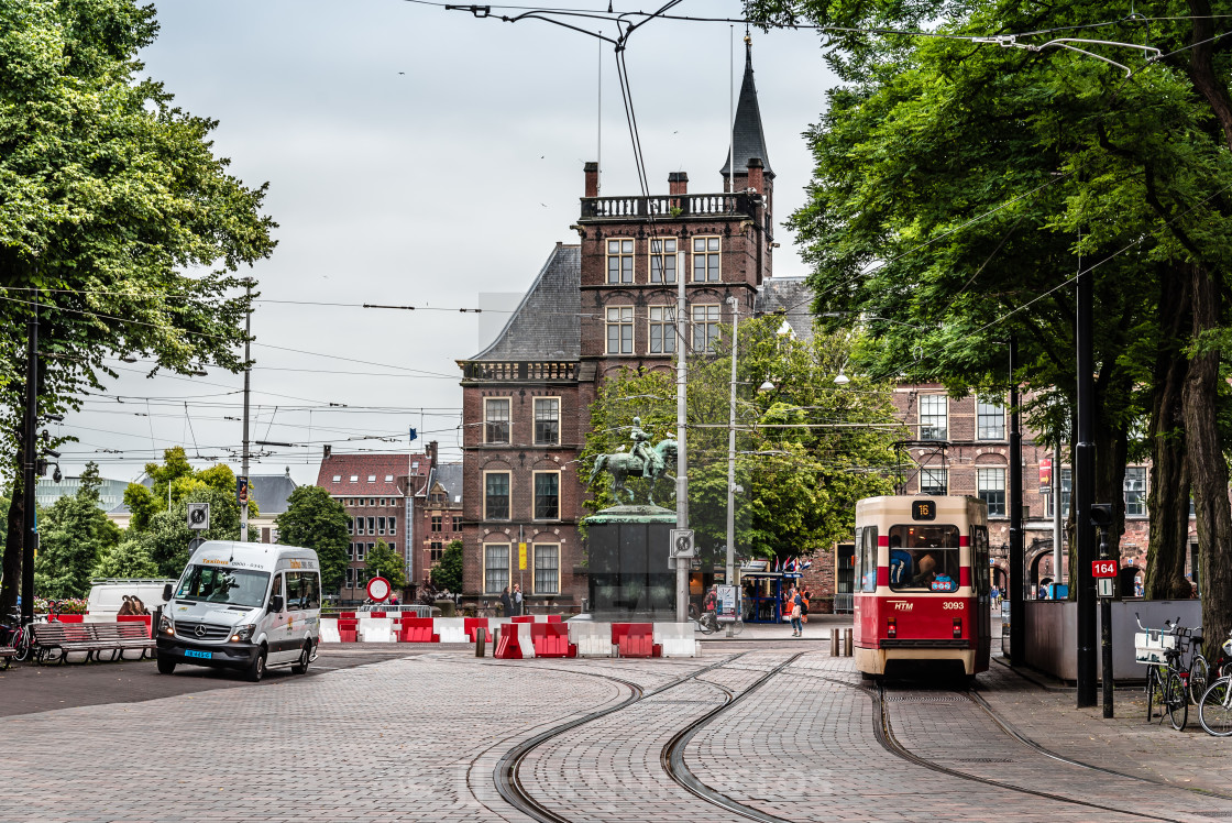 "Street view in the Hague with tram a cloudy day of summer." stock image