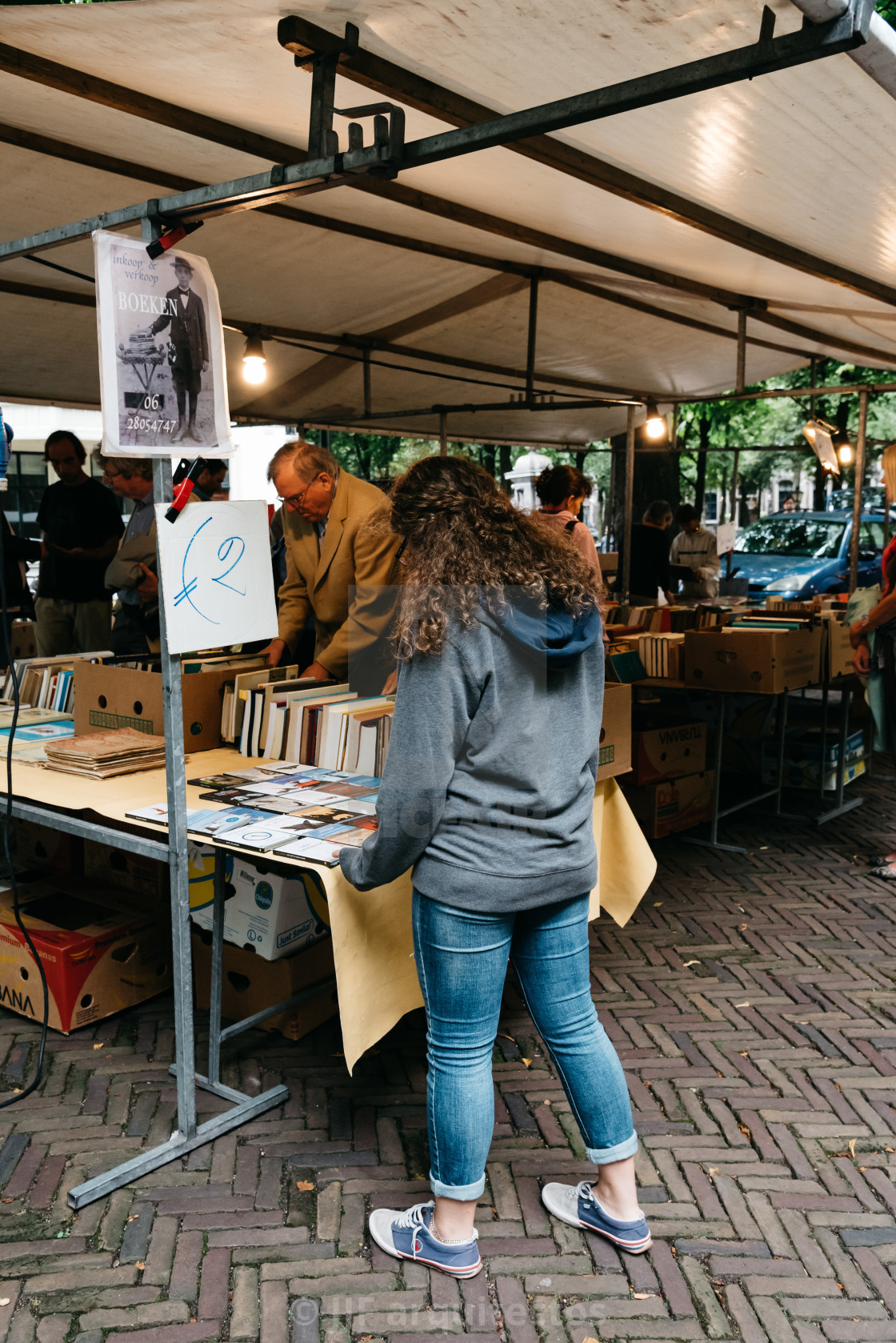 "Unidentified people in a book and antiques market stall in the s" stock image