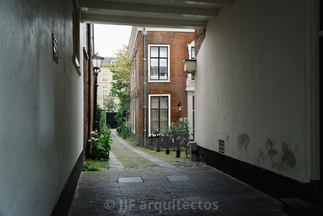 "View of typical street in the Hague with bicycles parked" stock image