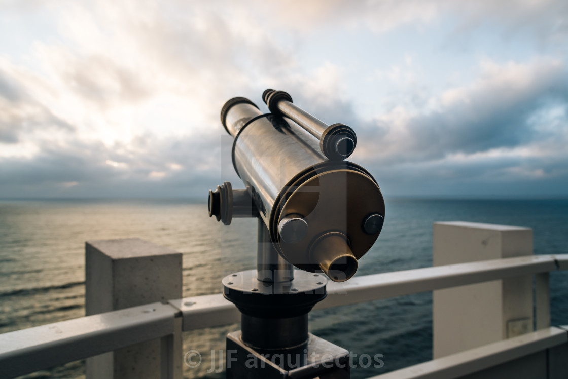 "Telescope in the beach at sunset, focus on foreground" stock image