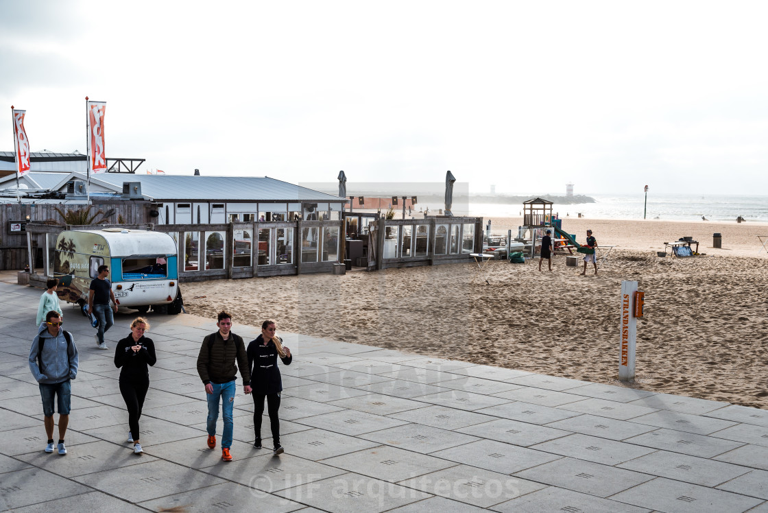 "Unidentified people near a beach bar a windy day in the beach of" stock image