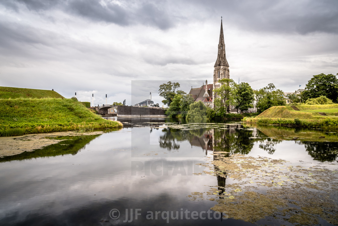 "Church reflected on water pond in Churchill Park in Copenhagen a" stock image